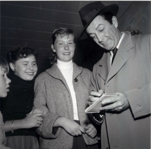 Signing an autograph for fans, ca. 1960.